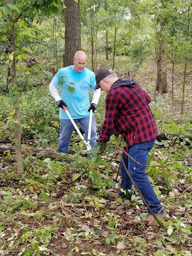 Lee Davis leading honeysuckle cleanup